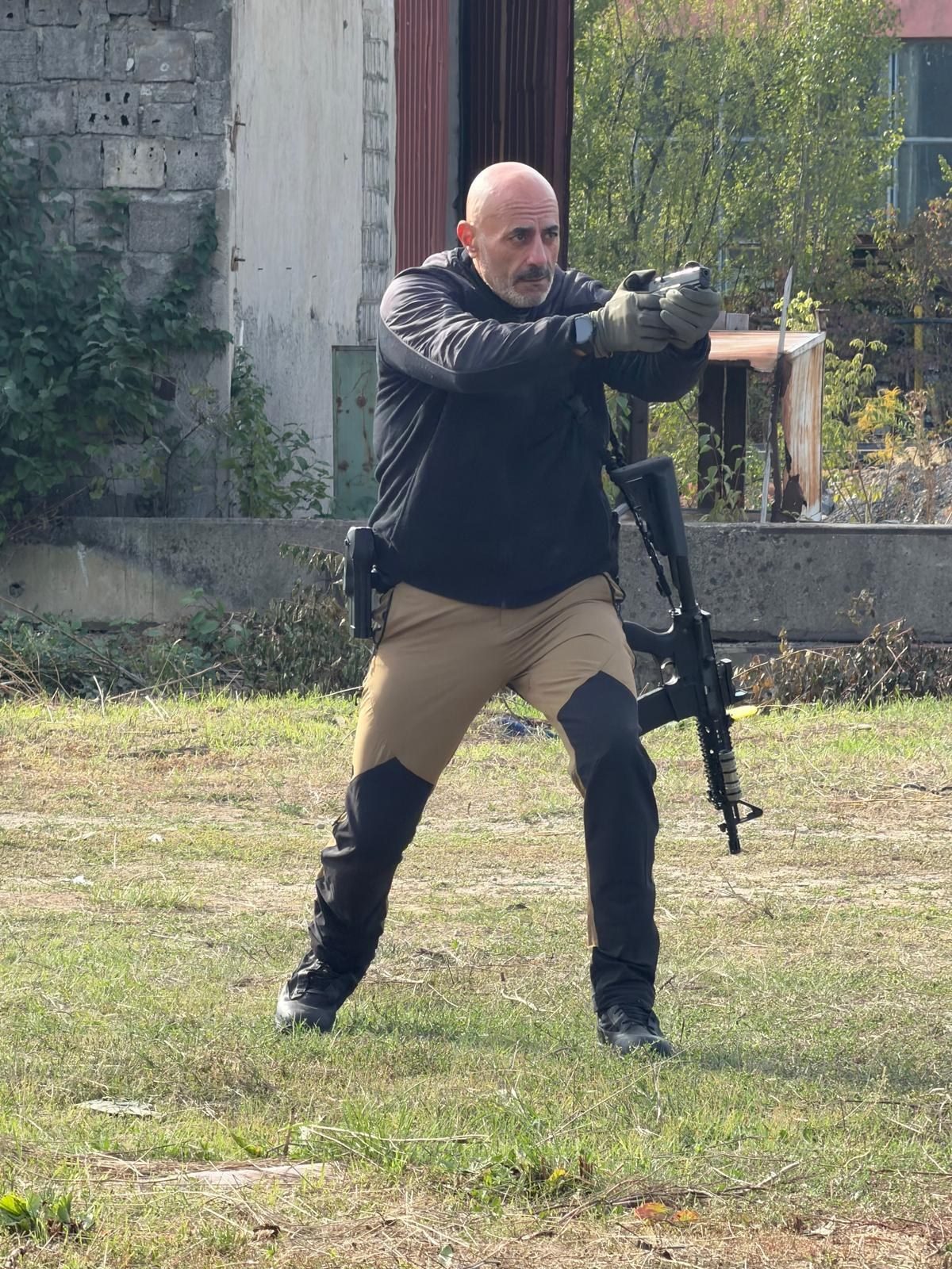 Trainee practising pistol shooting during the course
